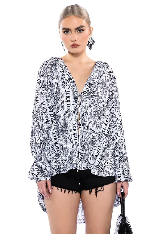 THAT NEW NEWS PRINTED PLEATED TIE FRONT BLOUSE